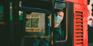 Man in a mask on a bus